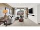 Well-lit living room showcases a sectional sofa, contemporary decor, and mounted television at 2230 Hemlock Cir, Greenfield, IN 46140