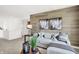 Cozy living room with a comfortable sectional sofa, stylish decor, and eye-catching horse artwork at 2230 Hemlock Cir, Greenfield, IN 46140
