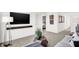 Stylish living room with modern decor, sleek furniture, and an open doorway to the bedroom at 2230 Hemlock Cir, Greenfield, IN 46140