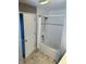 Bathroom with tub and shower featuring tile surround and a shower curtain at 2250 N Pennsylvania St # 8, Indianapolis, IN 46205