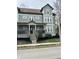 Charming exterior view with a welcoming front porch and beautiful landscaping at 2250 N Pennsylvania St # 8, Indianapolis, IN 46205