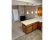 Kitchen island features quartz countertops, wooden cabinets, and modern pendant lighting at 2250 N Pennsylvania St # 8, Indianapolis, IN 46205