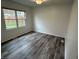 Cozy bedroom with a window, closet, and modern flooring at 265 Bittersweet Dr, Whiteland, IN 46184