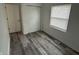 Cozy bedroom with a window, closet, and modern flooring at 265 Bittersweet Dr, Whiteland, IN 46184