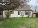 Lovely home showcasing a well-manicured lawn, decorative shrubs and vibrant green shutters adding character to the facade at 265 Bittersweet Dr, Whiteland, IN 46184