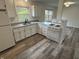 Kitchen view showcases white cabinets, modern countertops, and stainless steel appliances at 265 Bittersweet Dr, Whiteland, IN 46184