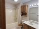 Bathroom features a shower-tub combination and a wooden vanity with a bright mirror and light at 2856 Colony Lake East Dr, Plainfield, IN 46168