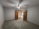 Bedroom with neutral decor, including gray carpeting and walls, and features double doors to another room at 2856 Colony Lake East Dr, Plainfield, IN 46168