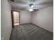This bedroom has neutral walls and carpeting and a ceiling fan, perfect for relaxation and comfort at 2856 Colony Lake East Dr, Plainfield, IN 46168