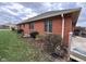 Charming brick home exterior featuring well-maintained landscaping and a lush lawn at 2856 Colony Lake East Dr, Plainfield, IN 46168