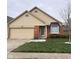 Charming single-story home with a well-manicured lawn, brick facade, and attached two-car garage at 2856 Colony Lake East Dr, Plainfield, IN 46168