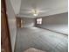 Spacious carpeted living room with a ceiling fan and natural light from a window at 2856 Colony Lake East Dr, Plainfield, IN 46168
