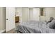 Bedroom with wood-look floors and an ensuite bathroom with a modern vanity at 2915 E 19Th St, Indianapolis, IN 46218