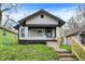 Charming renovated home featuring a covered porch, a well-kept lawn, and an inviting entrance at 2915 E 19Th St, Indianapolis, IN 46218