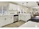 Bright kitchen features stainless steel appliances, white cabinets, and modern countertops at 2915 E 19Th St, Indianapolis, IN 46218