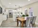 Bright open kitchen and dining area with stainless appliances, pendant lighting and modern finishes at 2915 E 19Th St, Indianapolis, IN 46218