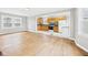Open living room and kitchen featuring hardwood floors and natural light, perfect for entertaining at 2920 Lincoln St, Anderson, IN 46016