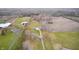 Panoramic aerial view of the property highlighting its serene location, ample land, and surrounding agricultural fields at 3110 S County Road 225 East, Danville, IN 46122