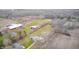 Stunning aerial view of property with multiple barns and buildings surrounded by fields and trees at 3110 S County Road 225 East, Danville, IN 46122