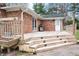 Spacious, multi-tiered wooden deck, featuring a barbecue grill and a staircase at 3110 S County Road 225 East, Danville, IN 46122