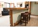 Home bar area with cozy stool seating adjacent to a comfortable living space, perfect for entertaining at 3110 S County Road 225 East, Danville, IN 46122