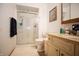 Clean bathroom with a glass-enclosed shower and a vanity with a granite countertop at 3110 S County Road 225 East, Danville, IN 46122