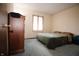 Comfortable bedroom with carpet, window, bed, and wooden armoire with plenty of natural light at 3110 S County Road 225 East, Danville, IN 46122