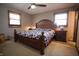 Cozy bedroom featuring a comfortable bed, bedside tables, and a ceiling fan at 3110 S County Road 225 East, Danville, IN 46122