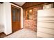 Multi-purpose bonus room featuring a brick wall, wooden trim, and ample storage at 3110 S County Road 225 East, Danville, IN 46122