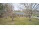 Aerial view of a charming brick home with a mature tree-lined yard and a peaceful, secluded setting at 3110 S County Road 225 East, Danville, IN 46122