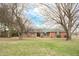 Charming brick ranch home featuring green shutters and a well-maintained front lawn at 3110 S County Road 225 East, Danville, IN 46122
