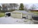Exterior of large garage and storage building, showcasing ample space with a black trailer parked nearby at 3110 S County Road 225 East, Danville, IN 46122