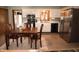 Bright kitchen with stainless steel appliances and eat-in dining with a wooden table and chair set at 3110 S County Road 225 East, Danville, IN 46122