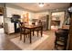 Charming kitchen with white cabinetry, stainless steel appliances, and adjacent breakfast area at 3110 S County Road 225 East, Danville, IN 46122