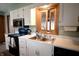 White kitchen sink with window, featuring modern appliances and bright lighting at 3110 S County Road 225 East, Danville, IN 46122