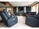 Cozy living room with plush seating, a modern TV, and seamless flow to the adjacent kitchen area at 3110 S County Road 225 East, Danville, IN 46122