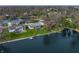 Waterfront homes feature well-manicured lawns and private docks on a tree-lined street with lake views at 315 Sunset Dr, Columbus, IN 47201