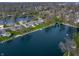 Waterfront homes on a tree-lined street boast lake views and private docks on a sunny day at 315 Sunset Dr, Columbus, IN 47201