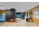 Finished basement with a black brick fireplace, a blue sofa, and unique decor at 315 Sunset Dr, Columbus, IN 47201
