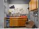 Basement workshop featuring an organized pegboard for tools, storage cabinets, and a work surface at 315 Sunset Dr, Columbus, IN 47201