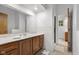 Bright bathroom with a wood vanity and shower room, offering a fresh and functional space at 315 Sunset Dr, Columbus, IN 47201