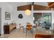 Bright dining room with modern lighting, a round table and seamless access to an adjacent room at 315 Sunset Dr, Columbus, IN 47201