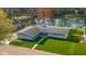 An aerial shot of a single story home with a large lawn and waterfront access on a sunny day at 315 Sunset Dr, Columbus, IN 47201