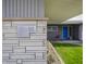 Close-up of home's stone facade with visible house number and courtyard seating at 315 Sunset Dr, Columbus, IN 47201