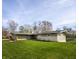 Well-maintained home featuring a spacious lawn and serene lake views at 315 Sunset Dr, Columbus, IN 47201