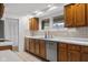 Well-lit kitchen featuring wood cabinetry, stainless steel appliances, and ample counter space at 315 Sunset Dr, Columbus, IN 47201