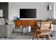 Comfortable living room featuring modern furniture, a patterned rug, and a mounted television at 315 Sunset Dr, Columbus, IN 47201