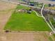 Expansive aerial view showcases the property's vast land and its proximity to the highway at 3308 S 600 E Rd, Waldron, IN 46182