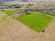 Expansive aerial view showcases the property's vast land and its proximity to the highway at 3308 S 600 E Rd, Waldron, IN 46182