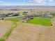 Expansive aerial view showcases the property's vast land and its proximity to the highway at 3308 S 600 E Rd, Waldron, IN 46182